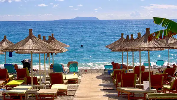 Dhermi coastline with blue water and mountain slopes on the Albanian Riviera