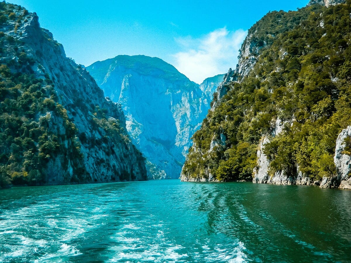 Lake Koman ferry route through a turquoise mountain gorge in northern Albania