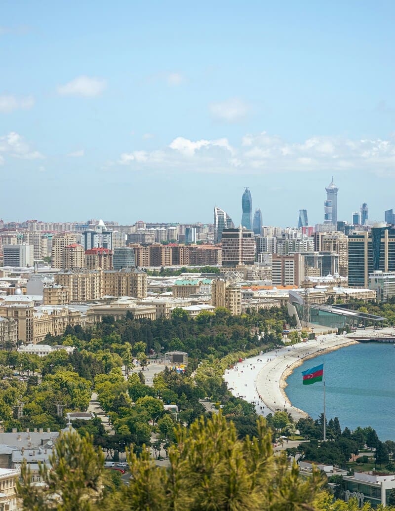 Baku Caspian Boulevard skyline with Azerbaijan flag and Flame Towers