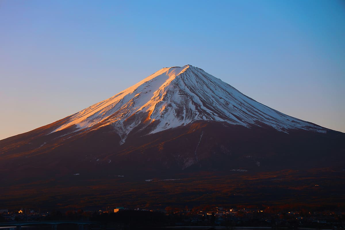 Mount Fuji with snow-covered peak at sunrise in Japan