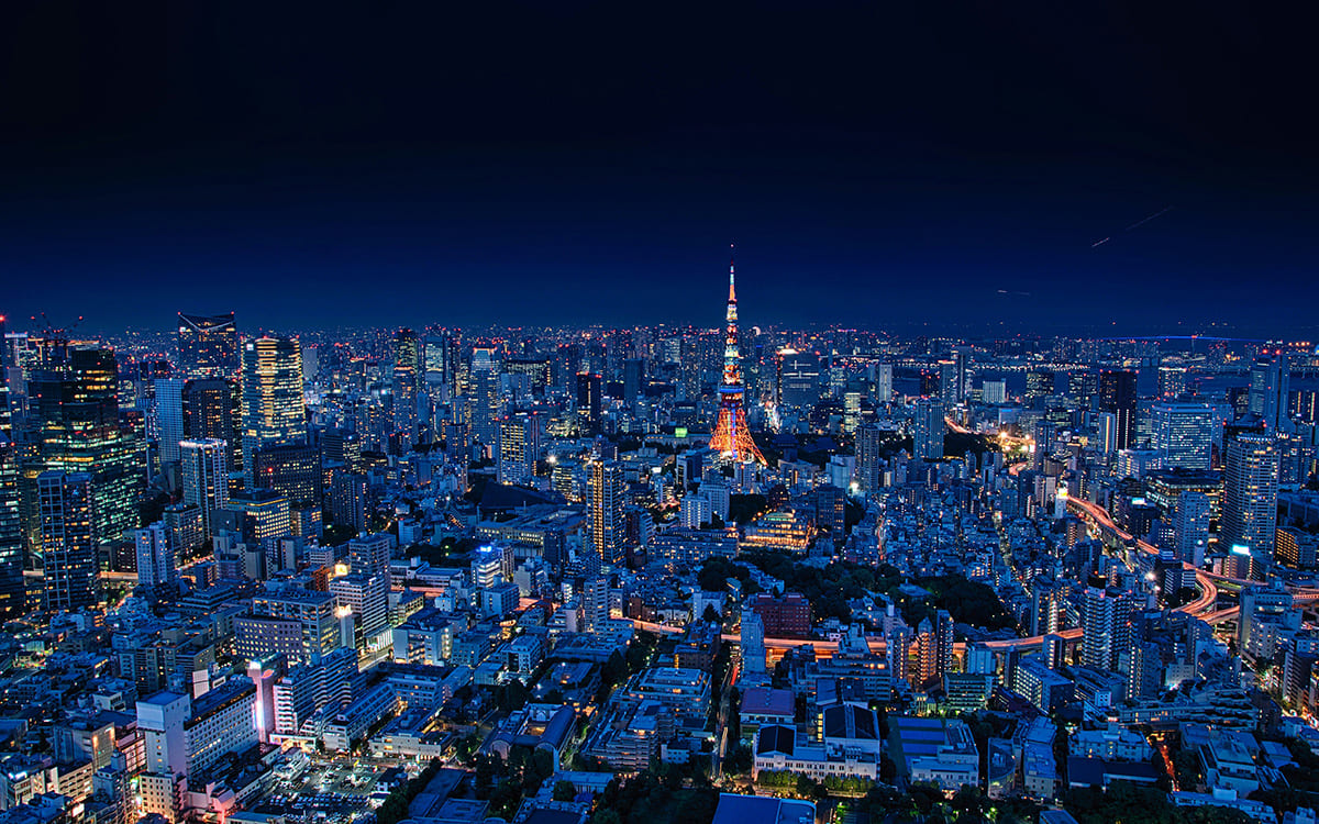 Tokyo skyline at night with illuminated buildings and tower view