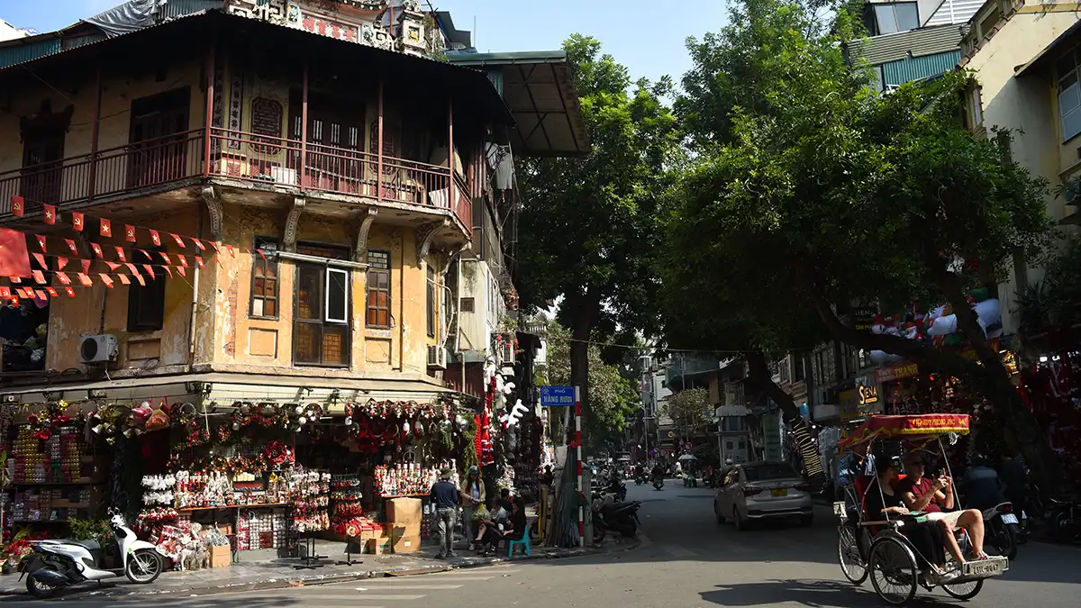 Street scene in Hanoi Old Quarter at the start of a Vietnam backpacking route