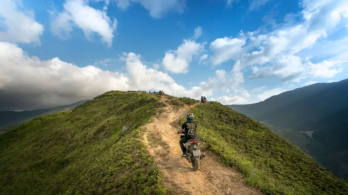 Easy rider motorbike tour on a mountain road in Ha Giang
