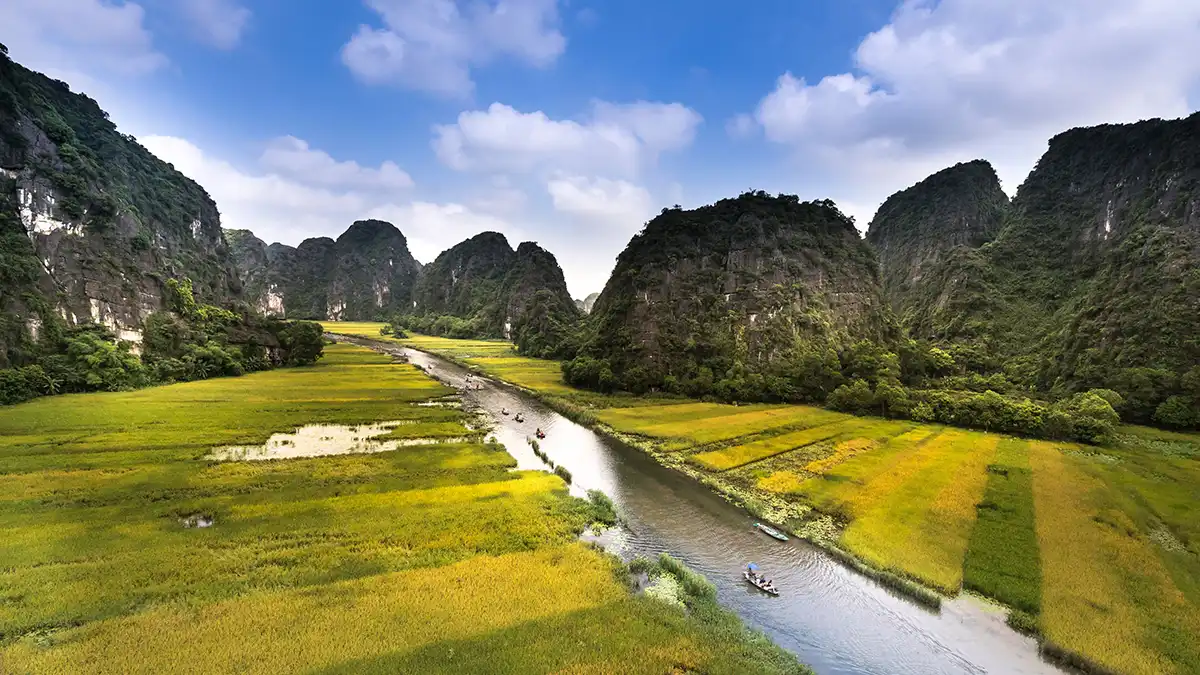River winding through limestone mountains in Ninh Binh, Vietnam