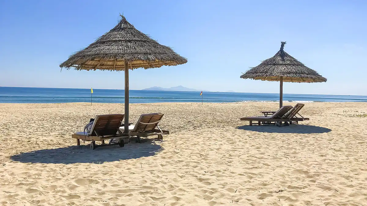 Sun loungers and umbrellas on An Bang Beach near Hoi An