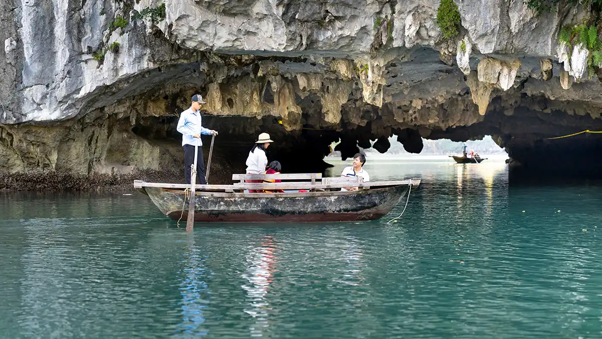 Rowing boat entering a cave on the Trang An boat route in Ninh Binh