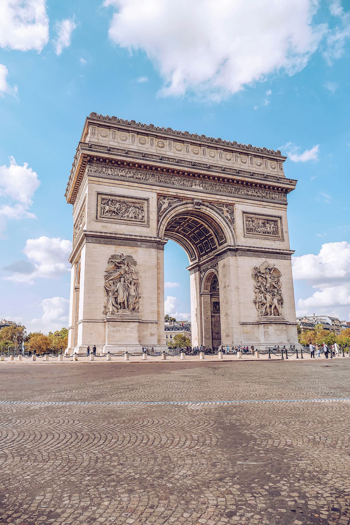 Close view of Arc de Triomphe monument with detailed carvings in Paris