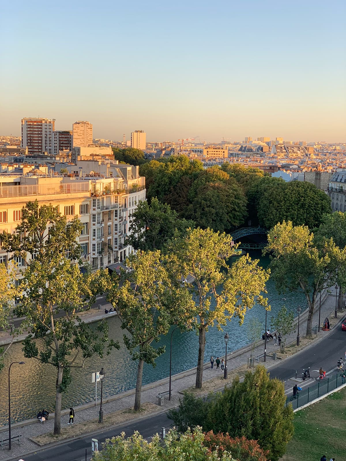 Aerial view of Canal Saint-Martin in Paris with trees and walking paths