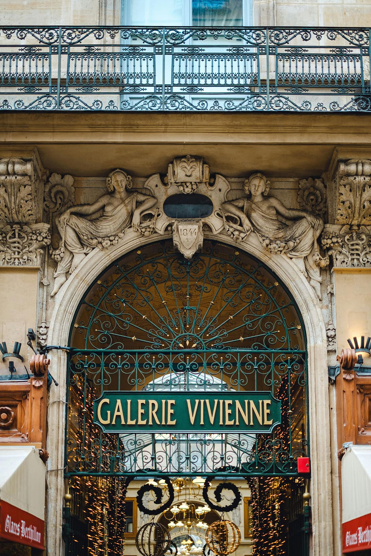 Entrance of Galerie Vivienne covered passage in Paris with decorative arch