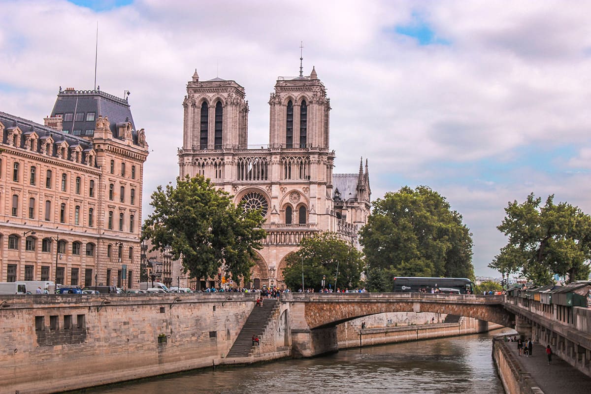 Notre Dame Cathedral with Seine River bridge view in central Paris