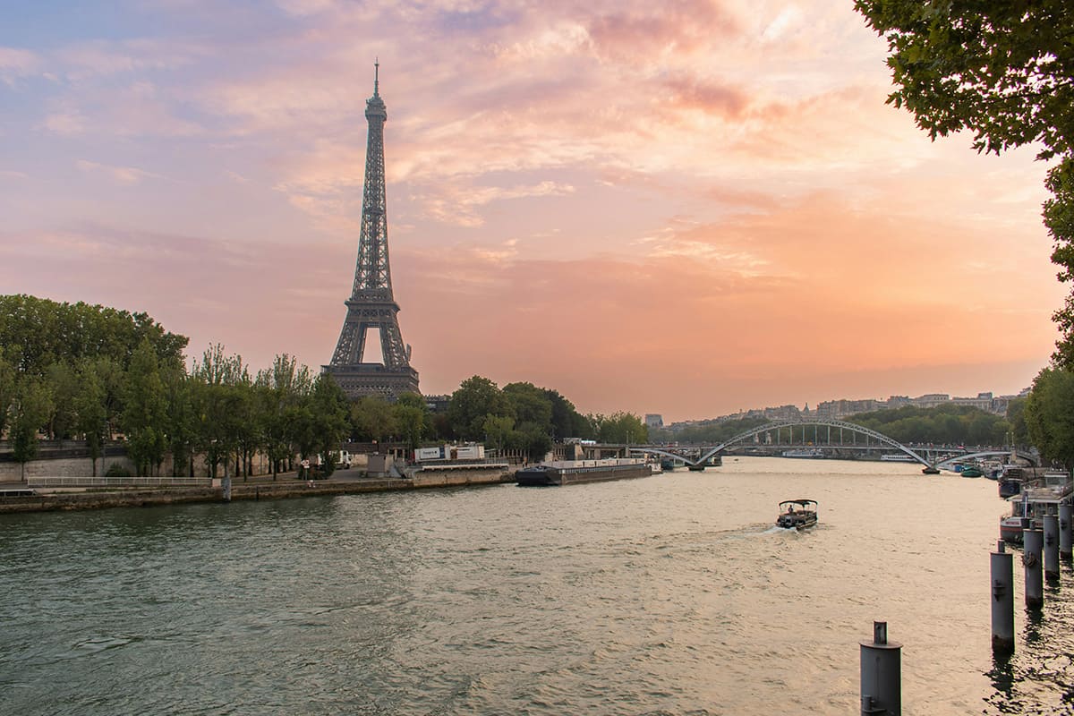Seine River cruise near Eiffel Tower at sunset in Paris