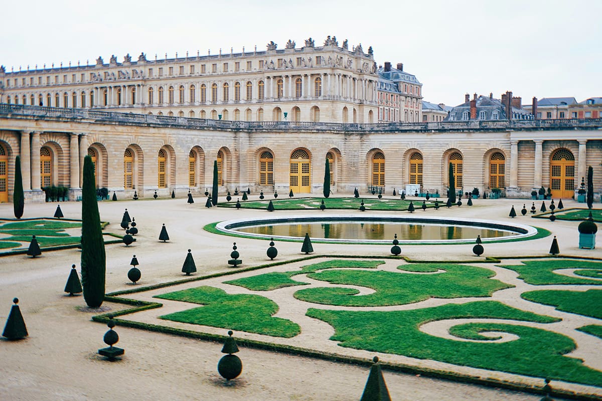 NVersailles Palace gardens with symmetrical landscape design and courtyard view