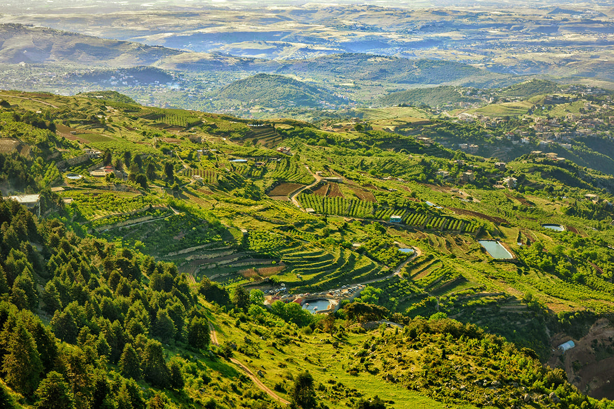 Green mountain valley landscape in Lebanon with villages and hills