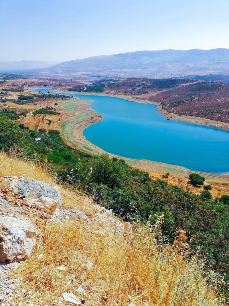 River valley and blue water surrounded by mountains in Lebanon