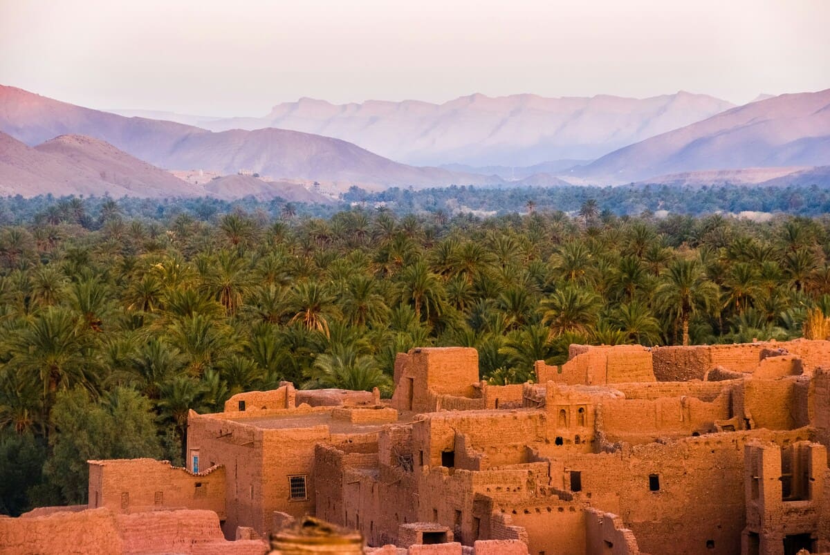 Ait Benhaddou kasbah and palm oasis landscape in Morocco