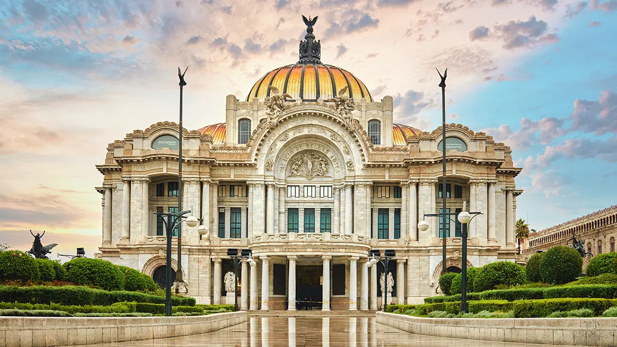 Palacio de Bellas Artes beneath a warm sky in Mexico City