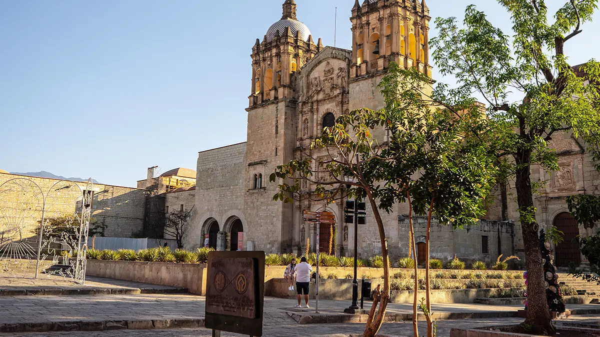 Church of Santo Domingo de Guzmán and its tree-lined plaza in Oaxaca
