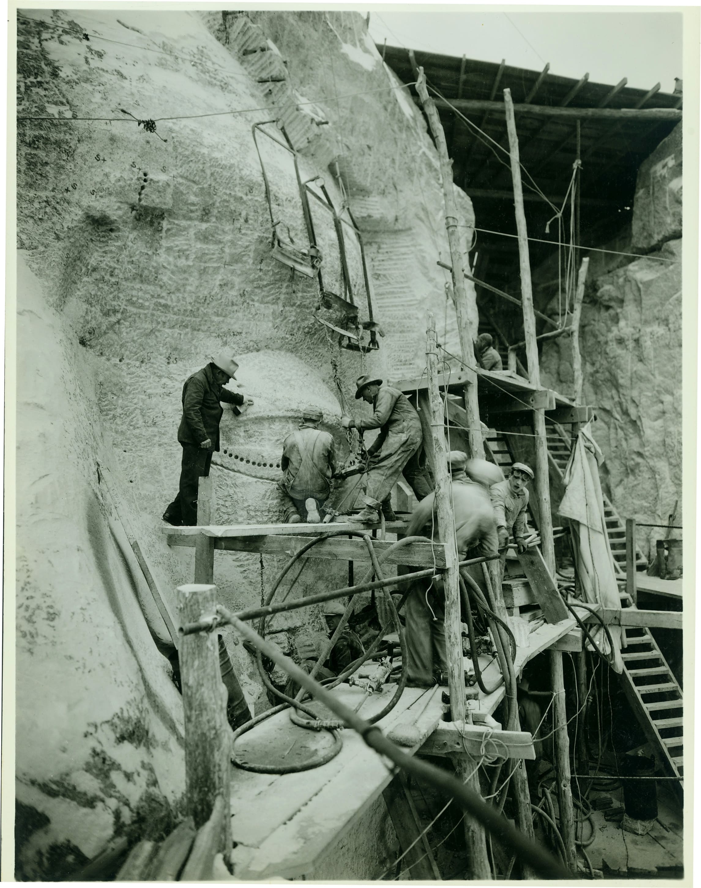 artist Gutzon Borglum oversees work on Mount Rushmore