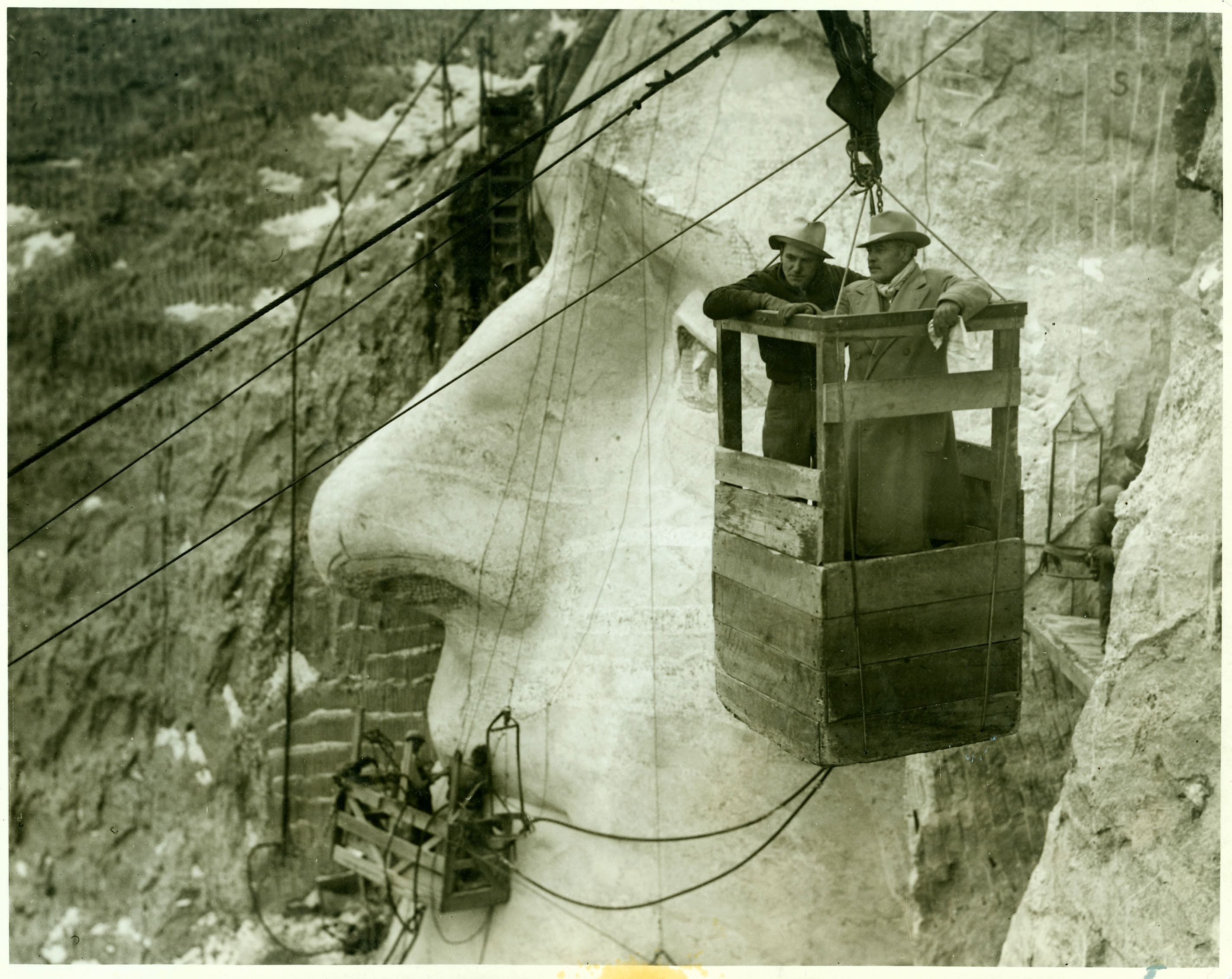 Gutzon Borglum and his son, Lincoln, use the tramway