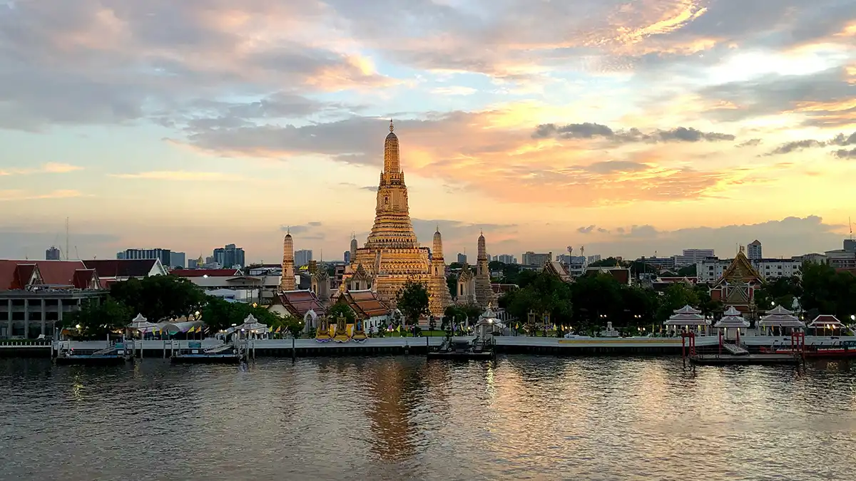 Bangkok river and temple skyline on a first-time Thailand itinerary