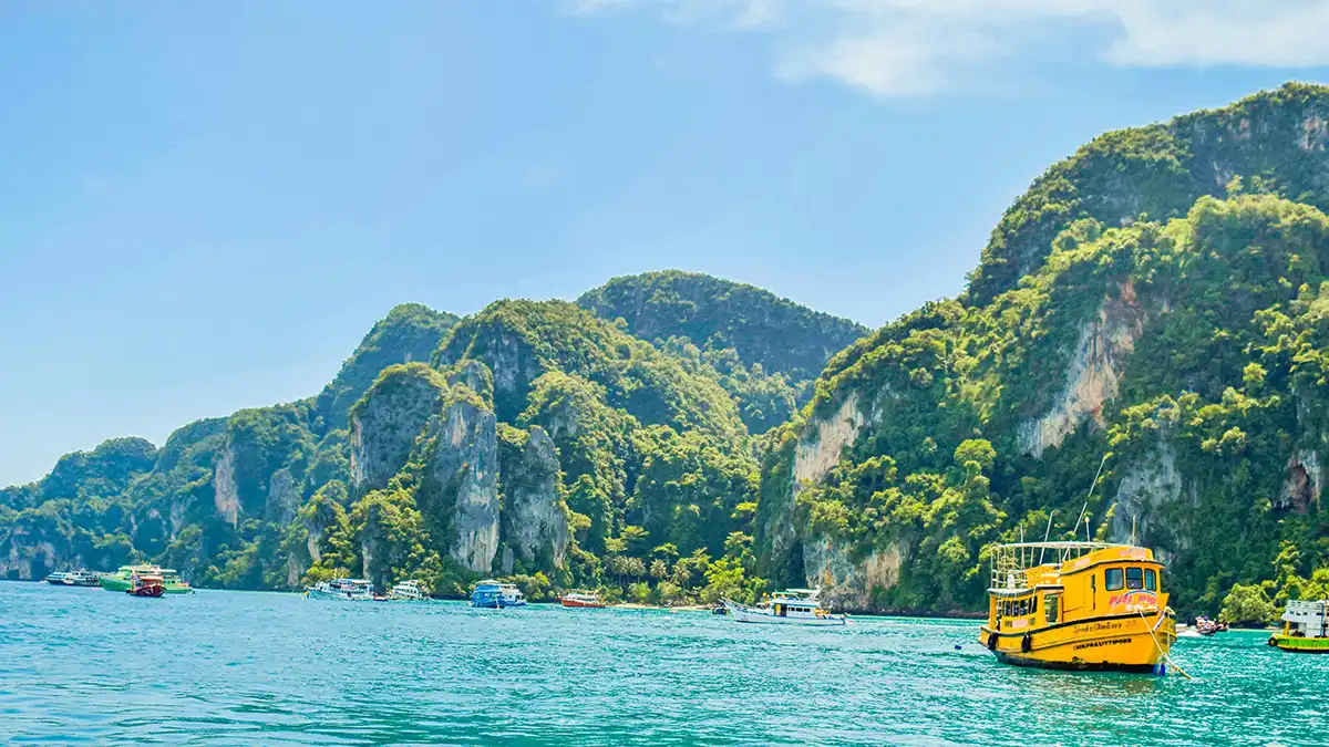 Boat trip along limestone islands in southern Thailand
