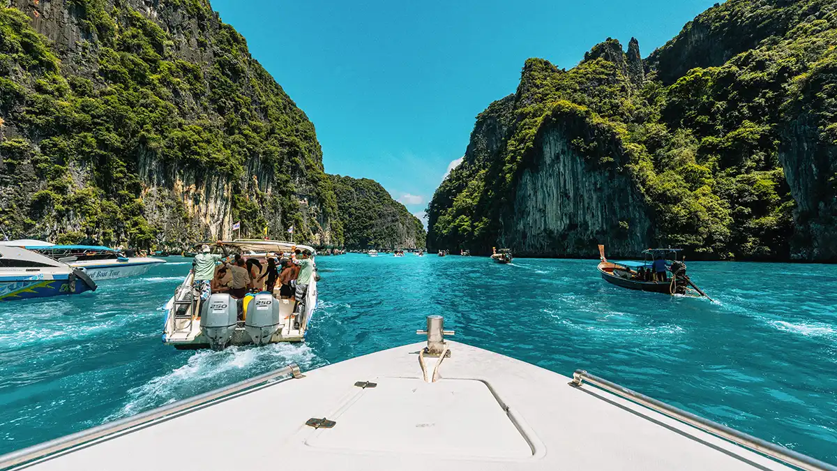 Boat trip among limestone islands in southern Thailand