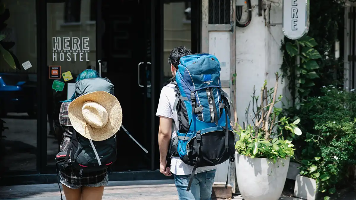 Backpackers arriving at a hostel in Bangkok Thailand