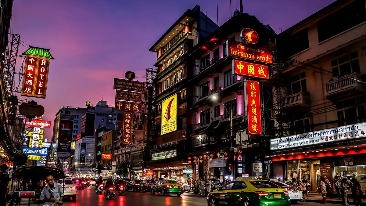 Busy Chinatown street in Bangkok at night during a Thailand backpacking trip