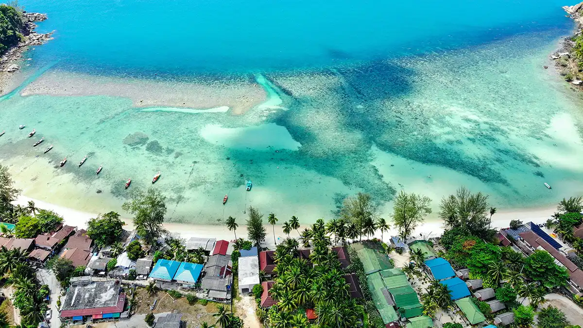 Aerial view of a beach and clear water on Koh Phangan Thailand