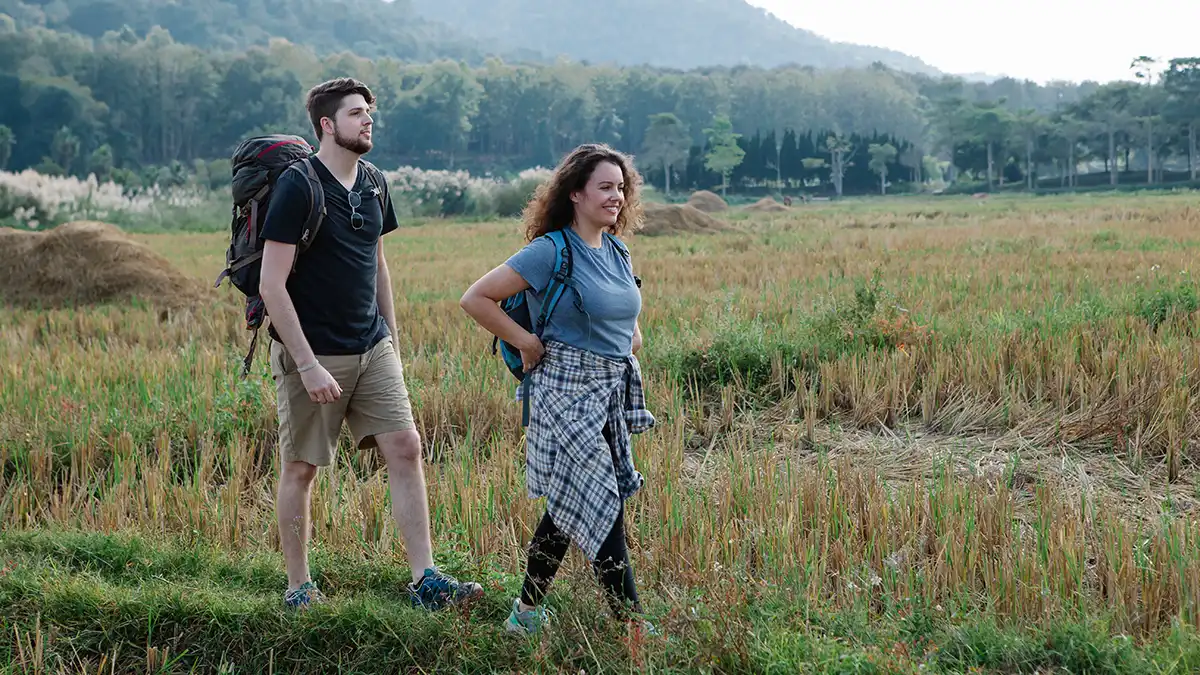 Two backpackers travelling with lightweight backpacks in northern Thailand