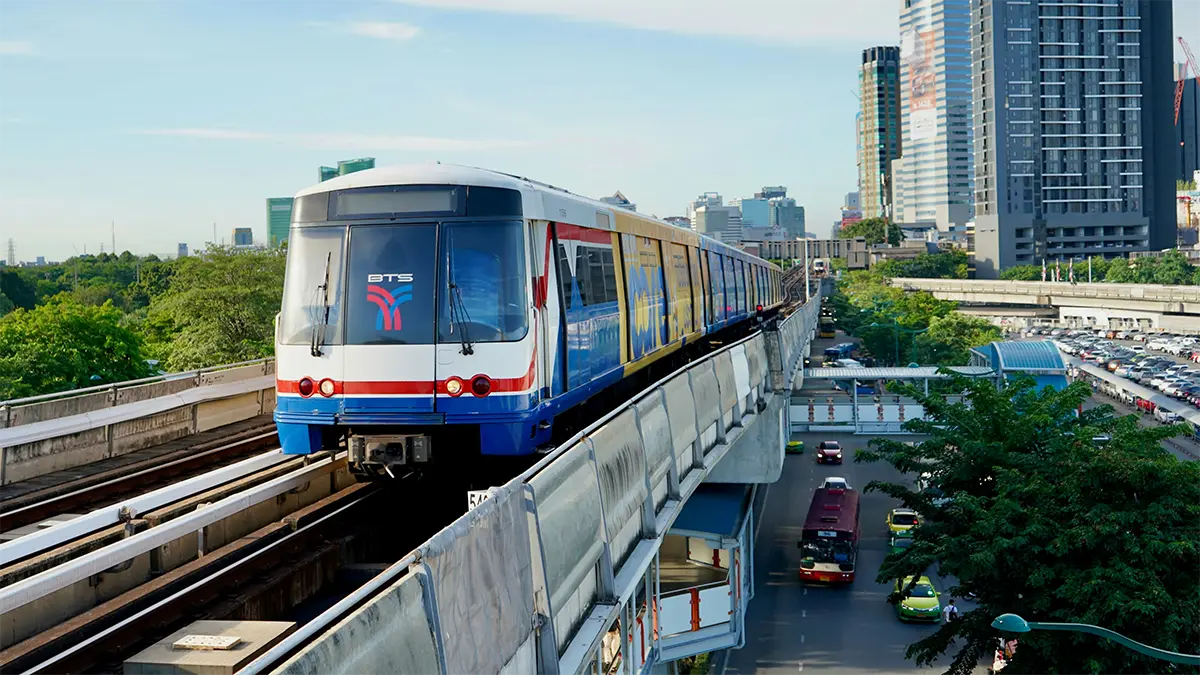 BTS Skytrain traveling above a road in Bangkok