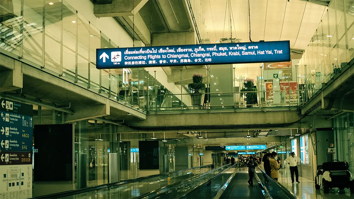 Passengers inside a Bangkok airport terminal used for domestic flights