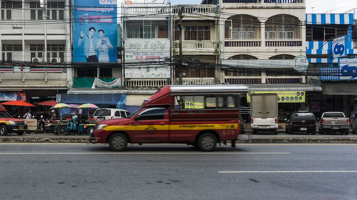 Red songthaew used for local transport in northern Thailand