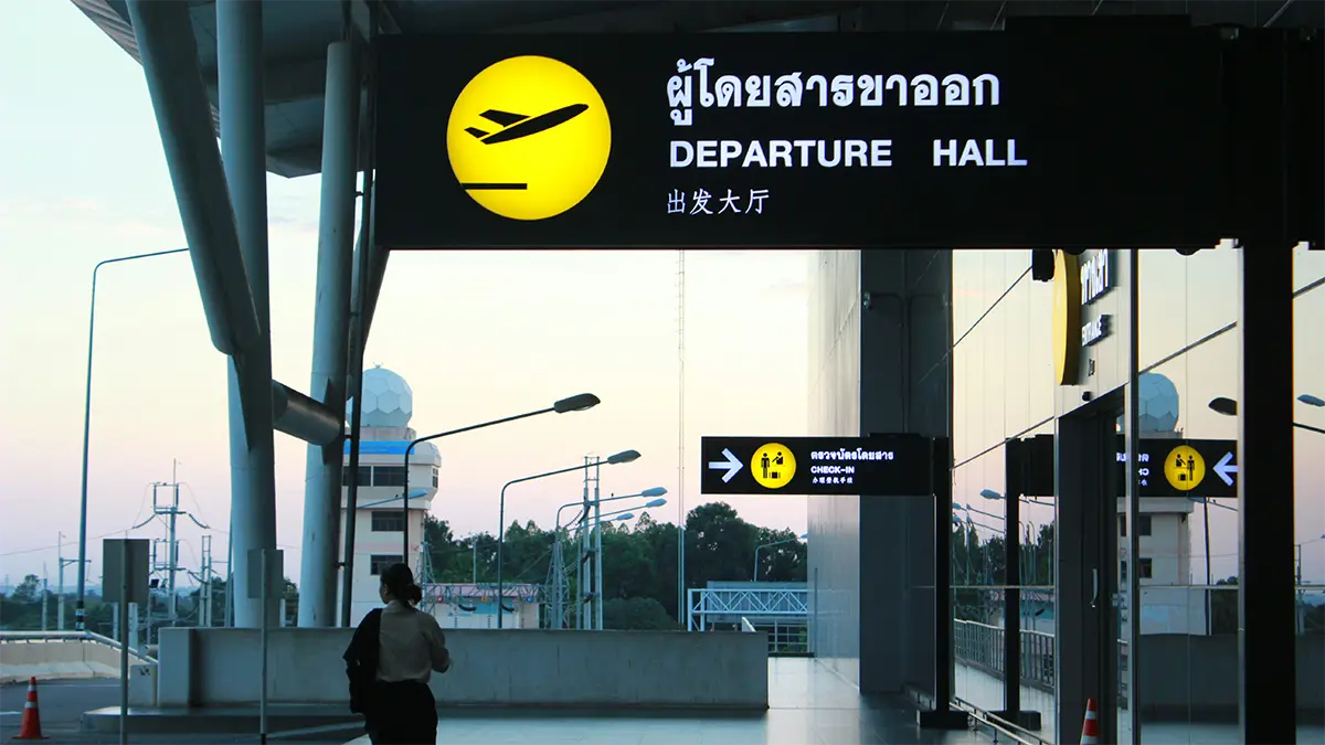 Traveler waiting inside a Thai airport before an onward flight