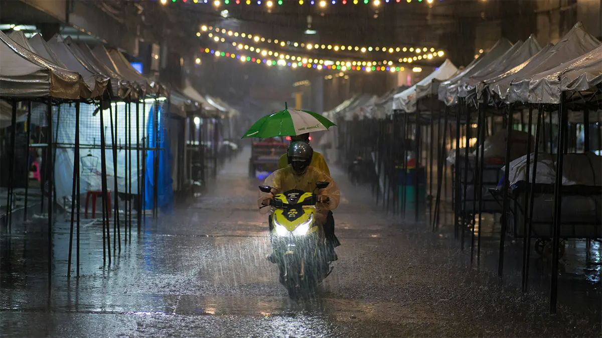 Road traffic moving through heavy rain in Thailand