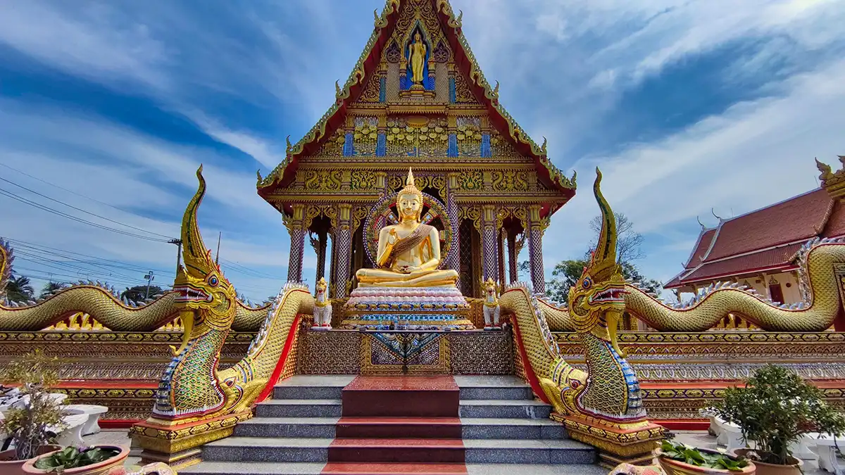 Visitors dressed respectfully for Thai temple etiquette in Thailand